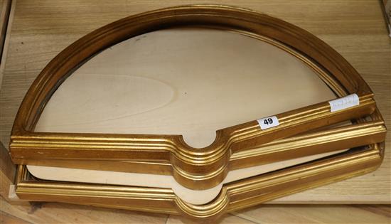 A set of four gilt fan cases 37 x 59cm